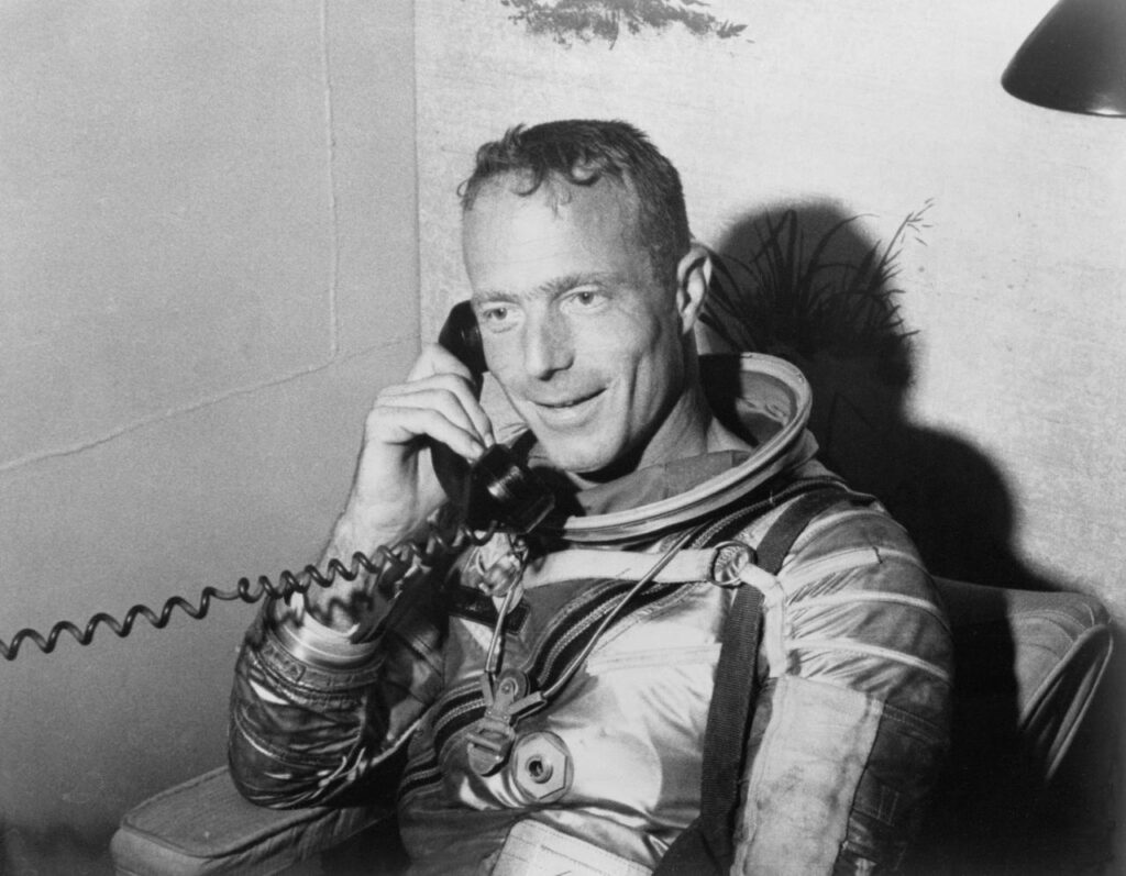 Scott Carpenter talks with President John F. Kennedy via radio-telephone from aboard the carrier USS Intrepid